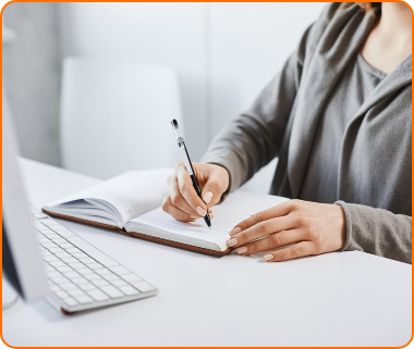 [fpdl.in]_i-prefer-old-school-writing-method-cropped-portrait-busy-woman-making-notes-notebook-looking-computer-screen-during-work-time-office-trying-concentrate-focus-assignment_176420-8697_large